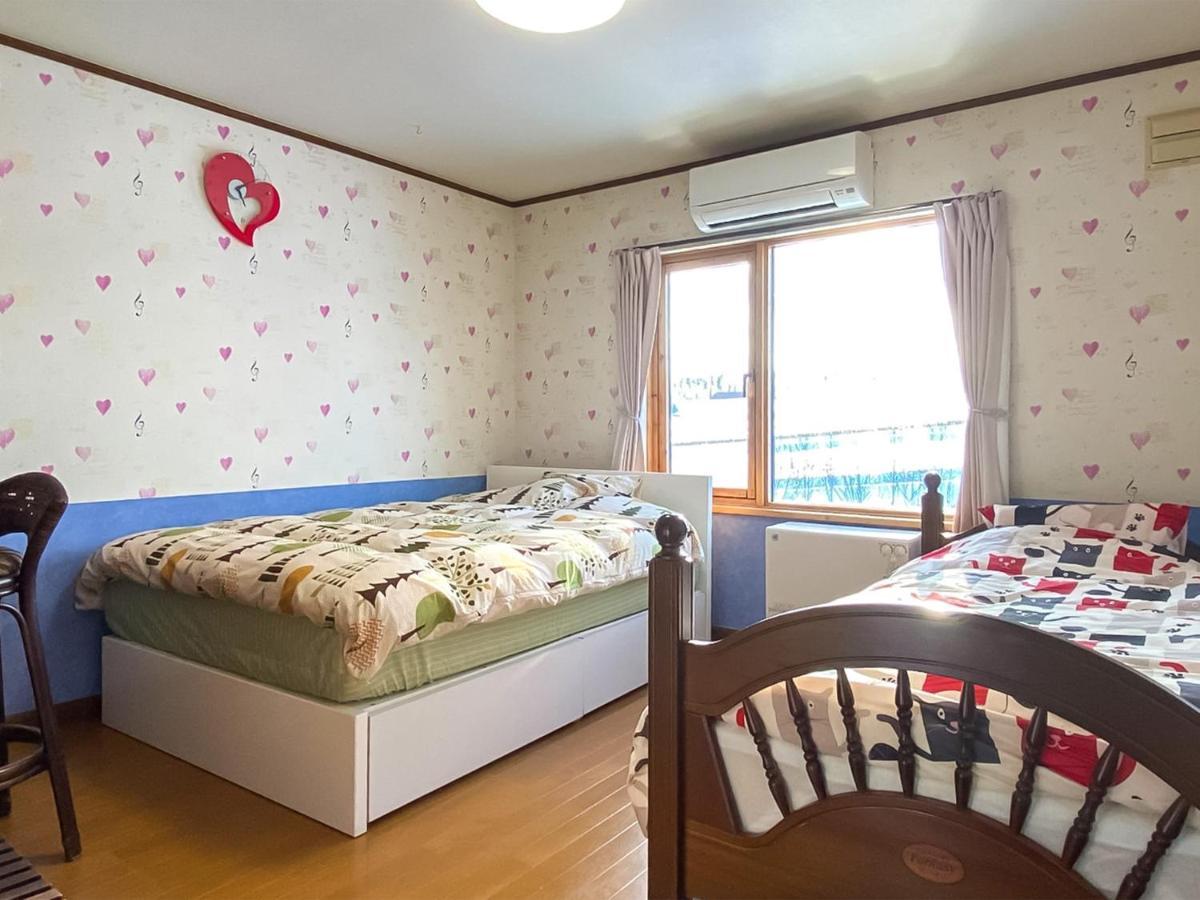 Ritz Garden Niji Guest House Biei Bagian luar foto